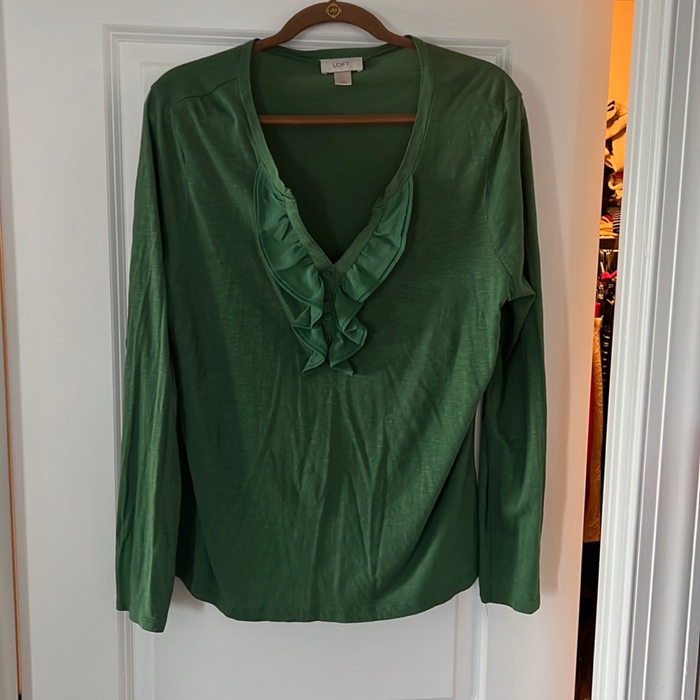 Jade colored top with ruffled v-neck.